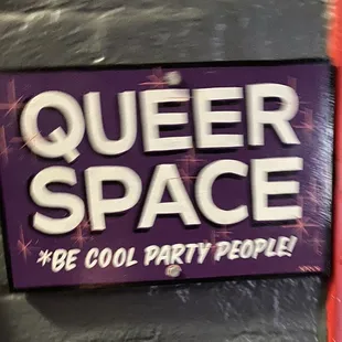 a purple sign with the words queer space be cool party people