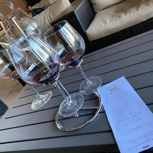 three glasses of wine on a table