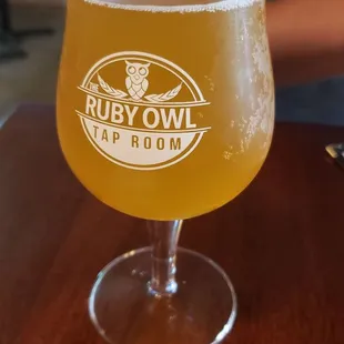 a glass of beer on a table