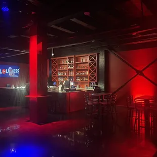 a bar with red lighting