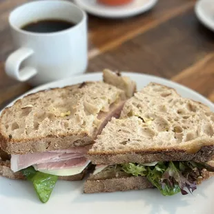 Deli sandwich with ham and drip coffee