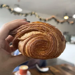 a person holding a pastry