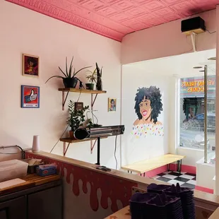 a woman's face painted on the wall