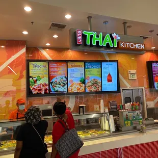 customers ordering food at the counter