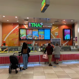 customers at the counter of a fast food restaurant