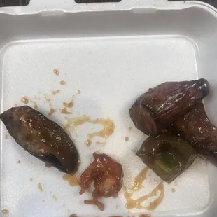 an open takeout container of food