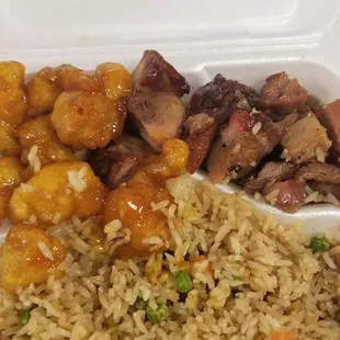 rice, meat, and vegetables in a styrofoam container