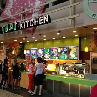 people standing in line at the counter