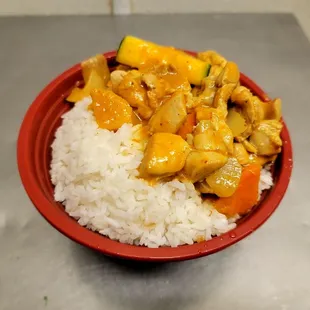 a bowl of rice and chicken