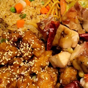 a plate of chicken, rice, and vegetables