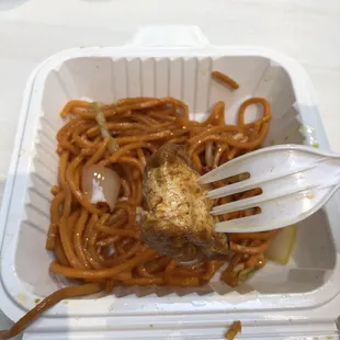 a fork stuck in the noodles