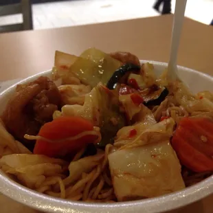 a bowl of noodles and vegetables