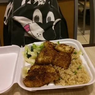 Blackened fish with fried rice.