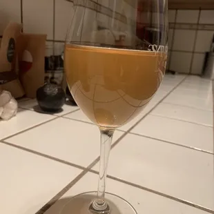 Wine that's turned to vinegar. Separation at the top and brown color.