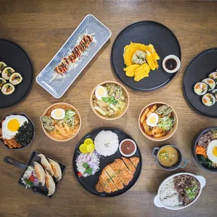 a variety of sushi dishes on a table