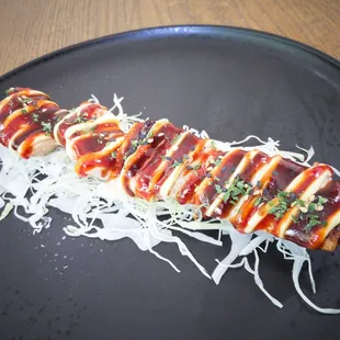 a close up of a skewer of food on a plate