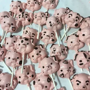 Pig suckers offered in 3 flavors: solid chocolate, caramel &amp; bacon, or caramel, bacon, &amp; nuts