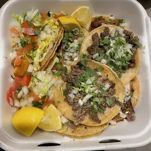 Carne asada tacos, fish tacos Underneath: Birria tacos &amp; Al pastor tacos