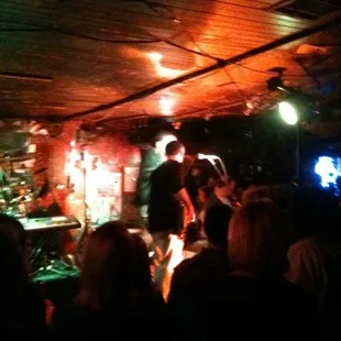 a band performing in a dimly lit room
