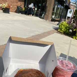 a box of donuts and a drink