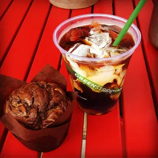 a cup of iced coffee and a muffin