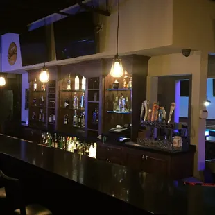 a bar with a lot of bottles