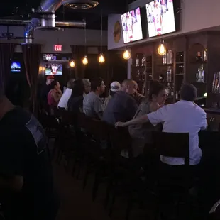 people sitting at the bar
