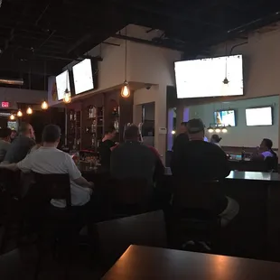 people sitting at the bar