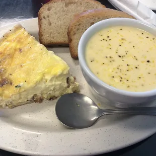 a bowl of soup and a slice of bread