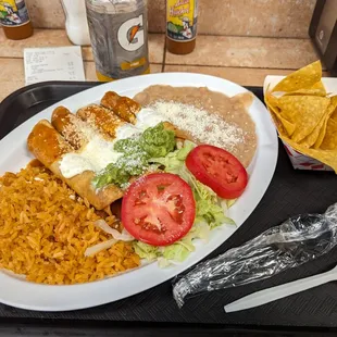 Chicken flautas with two sides, salad, guacamole and chips. :G) So goooood. Thx.