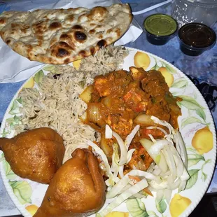 I don't remember what it's called but it's spicy and has chicken, bell peppers, onion and potato. It came with rice