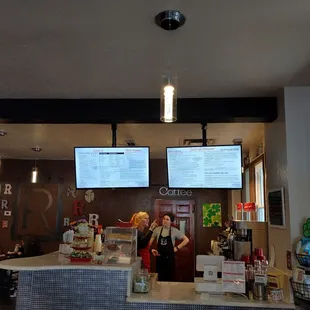two people standing at the counter