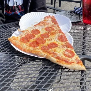 Crazy big pepperoni slice made him GRIN.