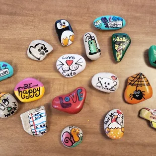 a variety of painted rocks