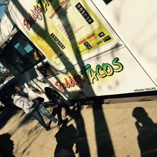 About 10 others wait for their quick fix of street tacos n burritos