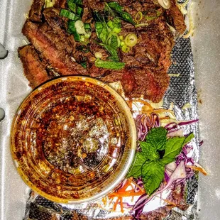 Crying Tiger: Thai-style grilled steak with 
 chili &amp; herb dipping sauce. $12