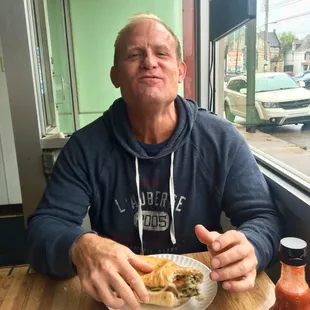 a man eating a sandwich