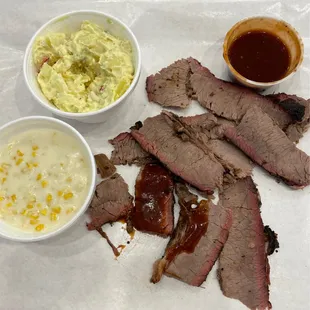 shows a plate of meat and sides