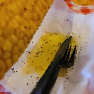 shows a fork and corn