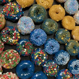 a variety of sprinkled donuts