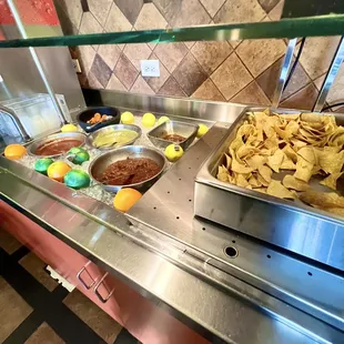 Serve yourself salsa bar. Mild, mediums, and spicy options. Plus hot chips!