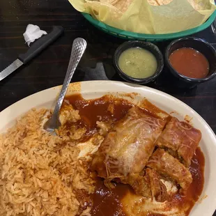 Tamales with red enchilada sauce. Delicious!