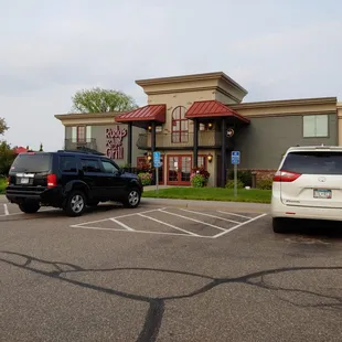 two cars parked in a parking lot