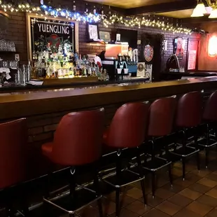 bar with red chairs