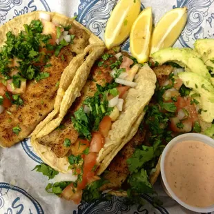Grilled Fish Tacos with Chipotle ranch dressing and avocado.