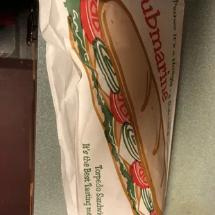 a sub sandwich wrapped in paper
