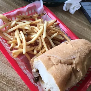 Half cheesesteak featuring French style fried potato sticks