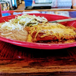 2 cheeese and onion enchiladas and a beef taco with rf-beans