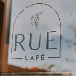 the reflection of the sign in the window