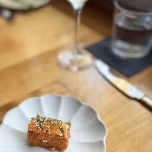 a piece of cake and a glass of wine